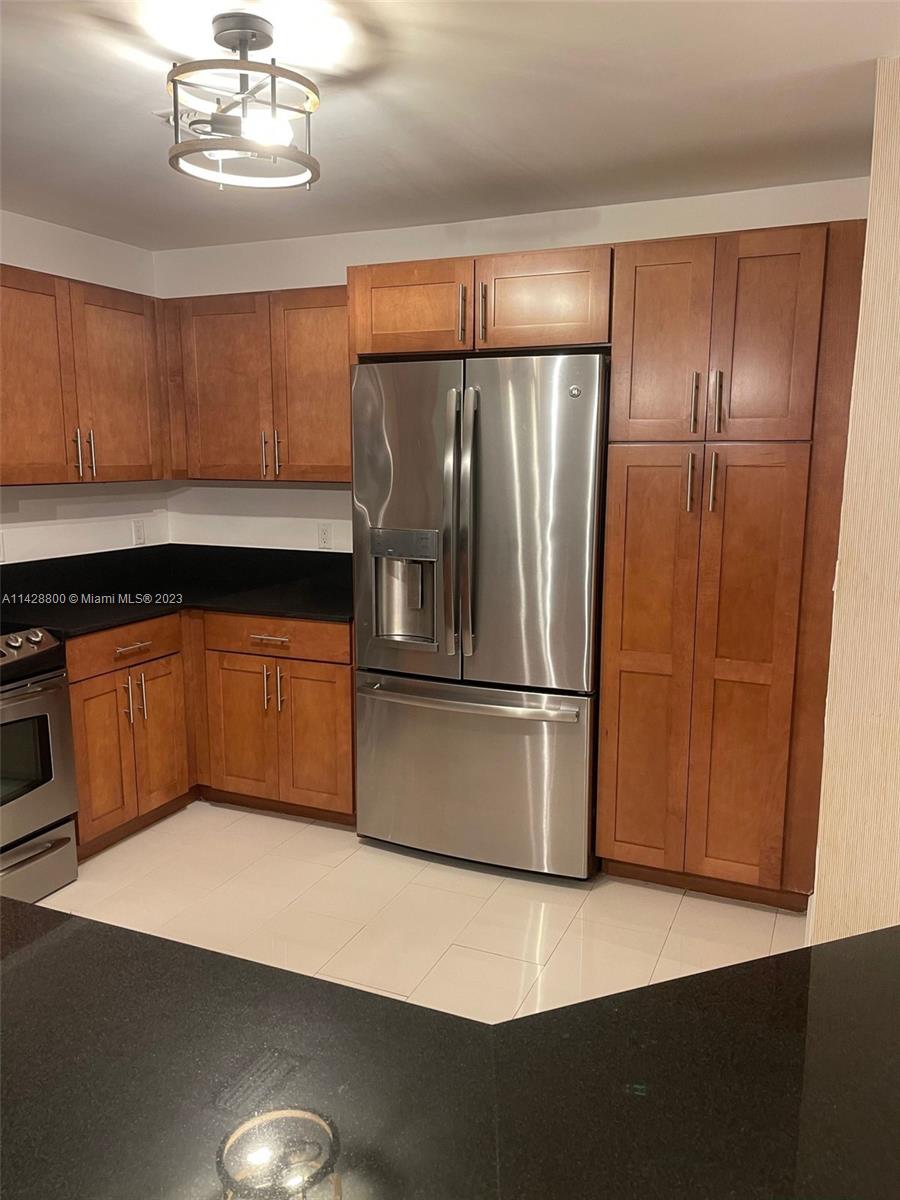 Se Colonnade at Dadeland Condominiums Miami, FL 33143 - Photo 7 of 32 a kitchen with stainless steel appliances a refrigerator a sink a stove and cabinets