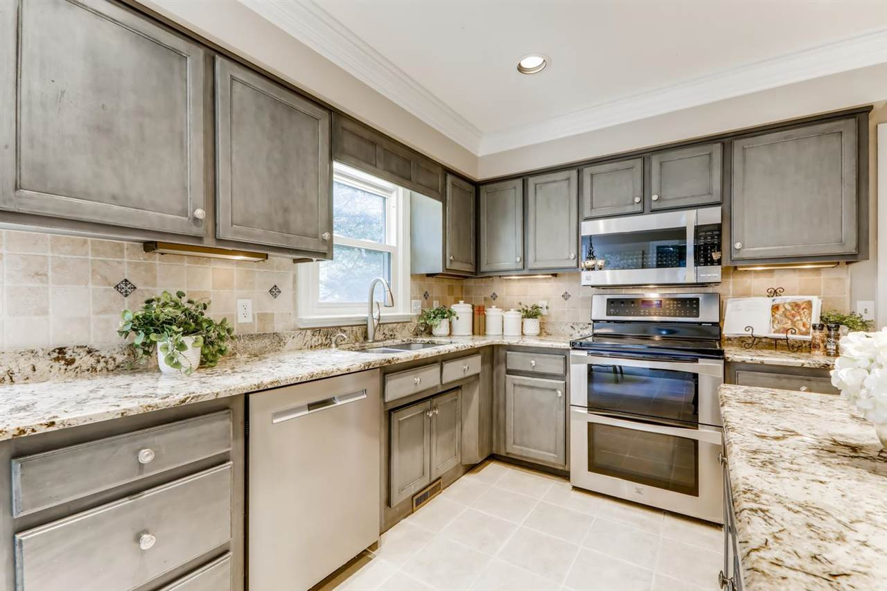 2021 Hamrick Drive Raleigh, NC 27615 - Photo 2 of 13 Another view of the bright open kitchen! There is MUD ROOM and back stairs to easily access the BONUS room too! Kitchen