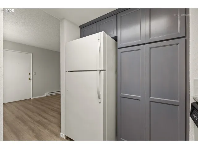 a white refrigerator freezer sitting in a kitchen