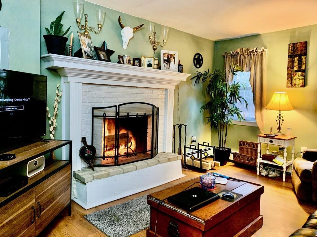 5 Brook Road Holland, MA 01521 - Photo 3 of 16 a living room with furniture and a fireplace