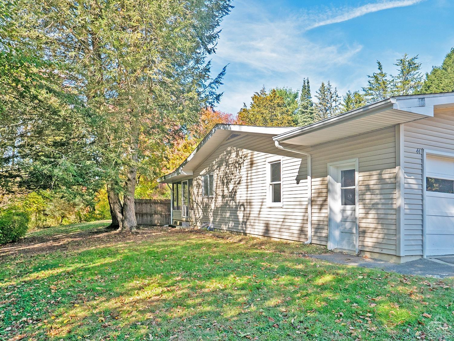44 Benner Road Red Hook, NY 12571 - Photo 19 of 22 front view of a house with a yard