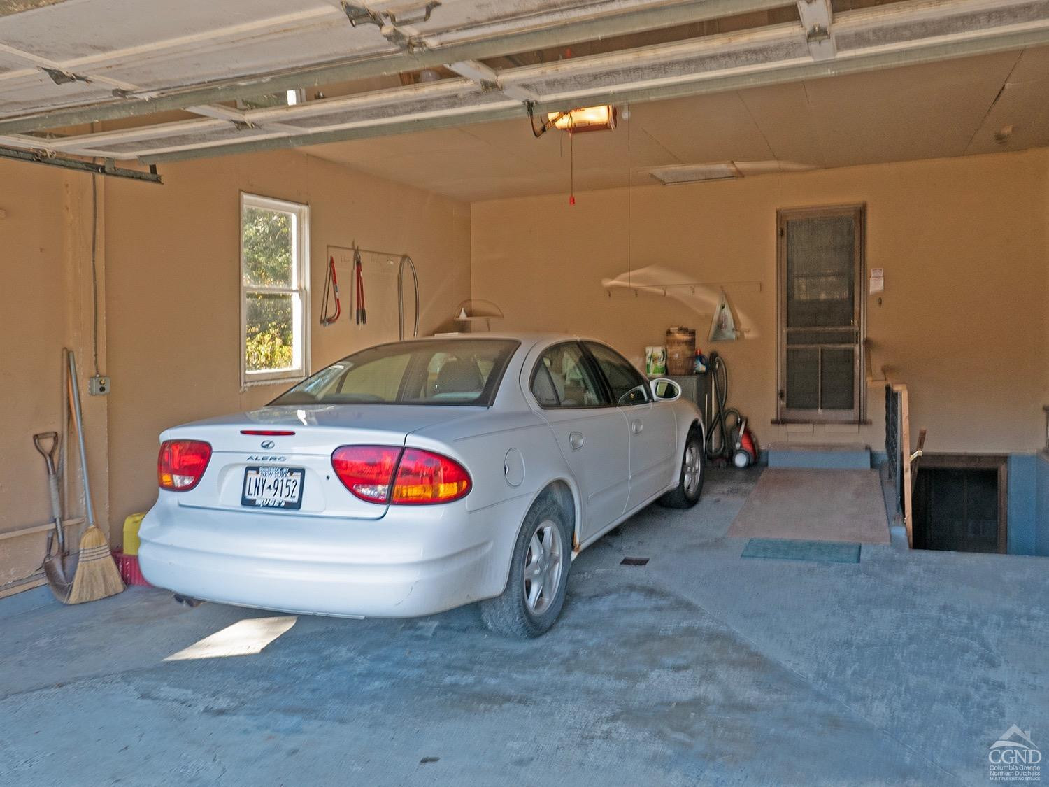 44 Benner Road Red Hook, NY 12571 - Photo 20 of 22 a living room with furniture and a flat screen tv