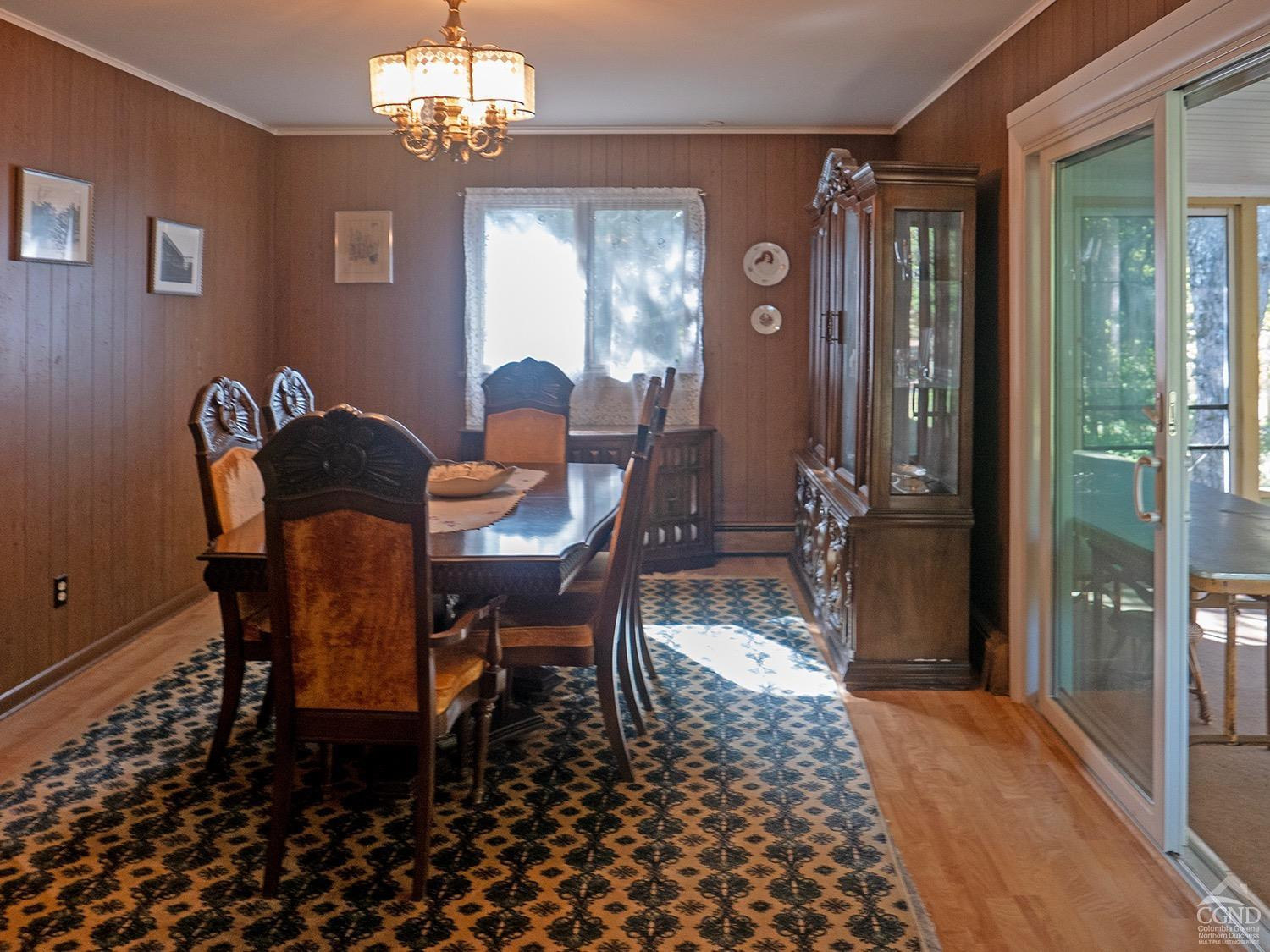 44 Benner Road Red Hook, NY 12571 - Photo 4 of 22 a view of a dining room with furniture and chandelier