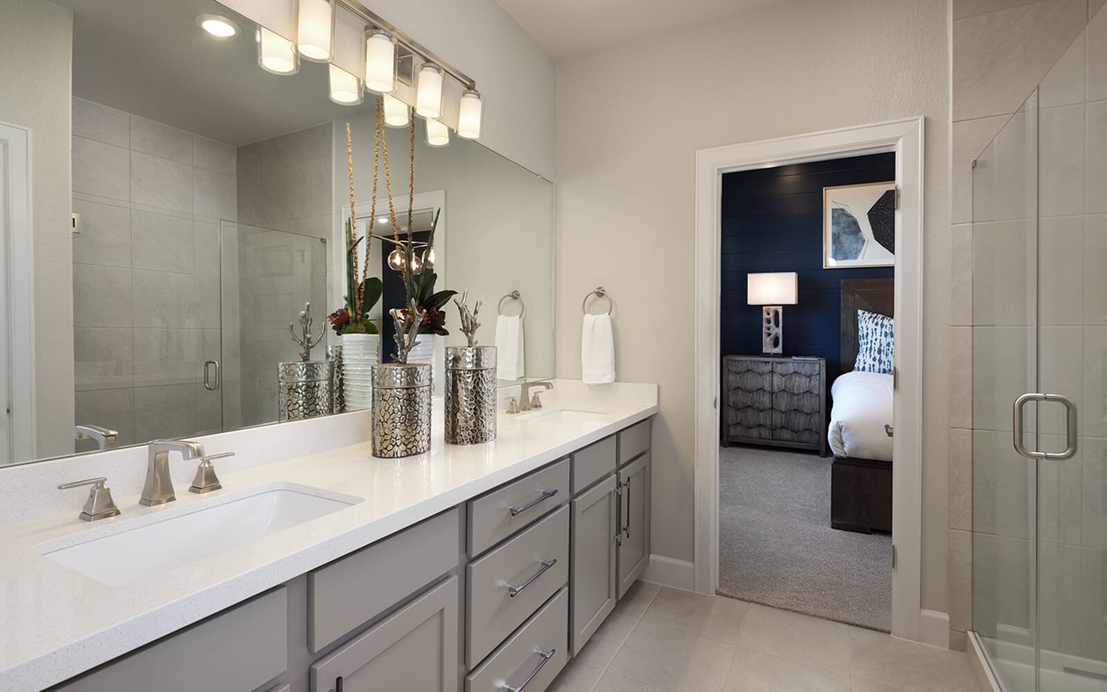 8810 Marmoset Way Austin, TX 78744 - Photo 4 of 19 a bathroom with a double vanity sink and a mirror