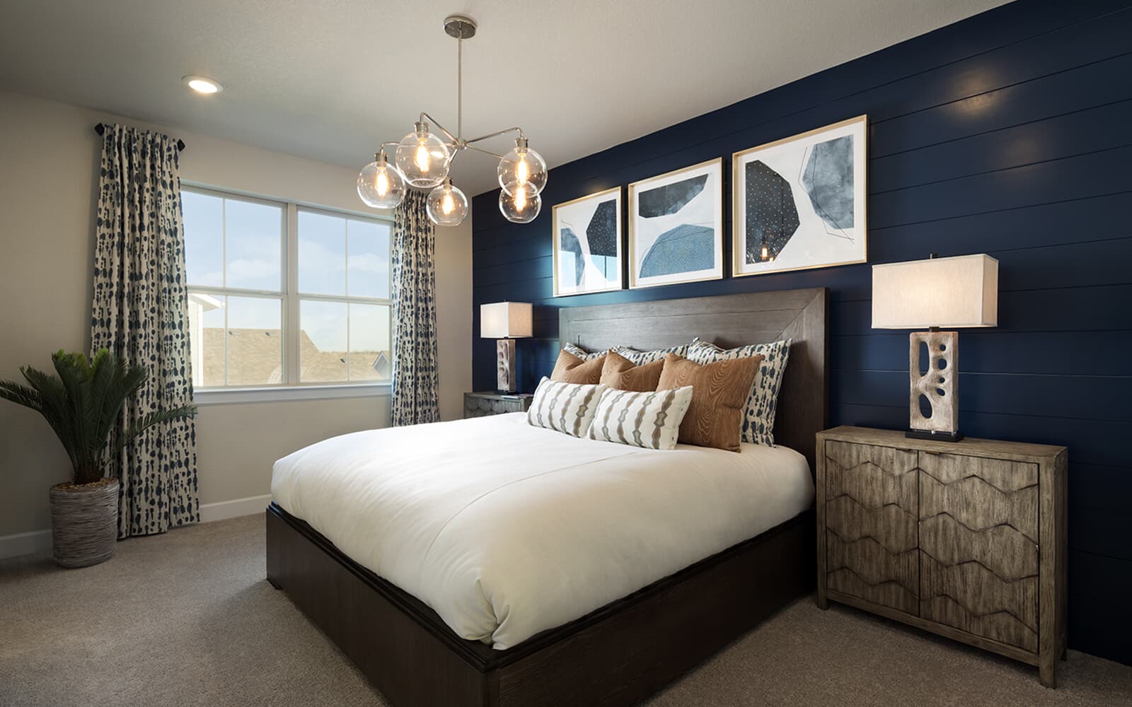 8810 Marmoset Way Austin, TX 78744 - Photo 6 of 19 a bedroom with a bed chandelier and a window