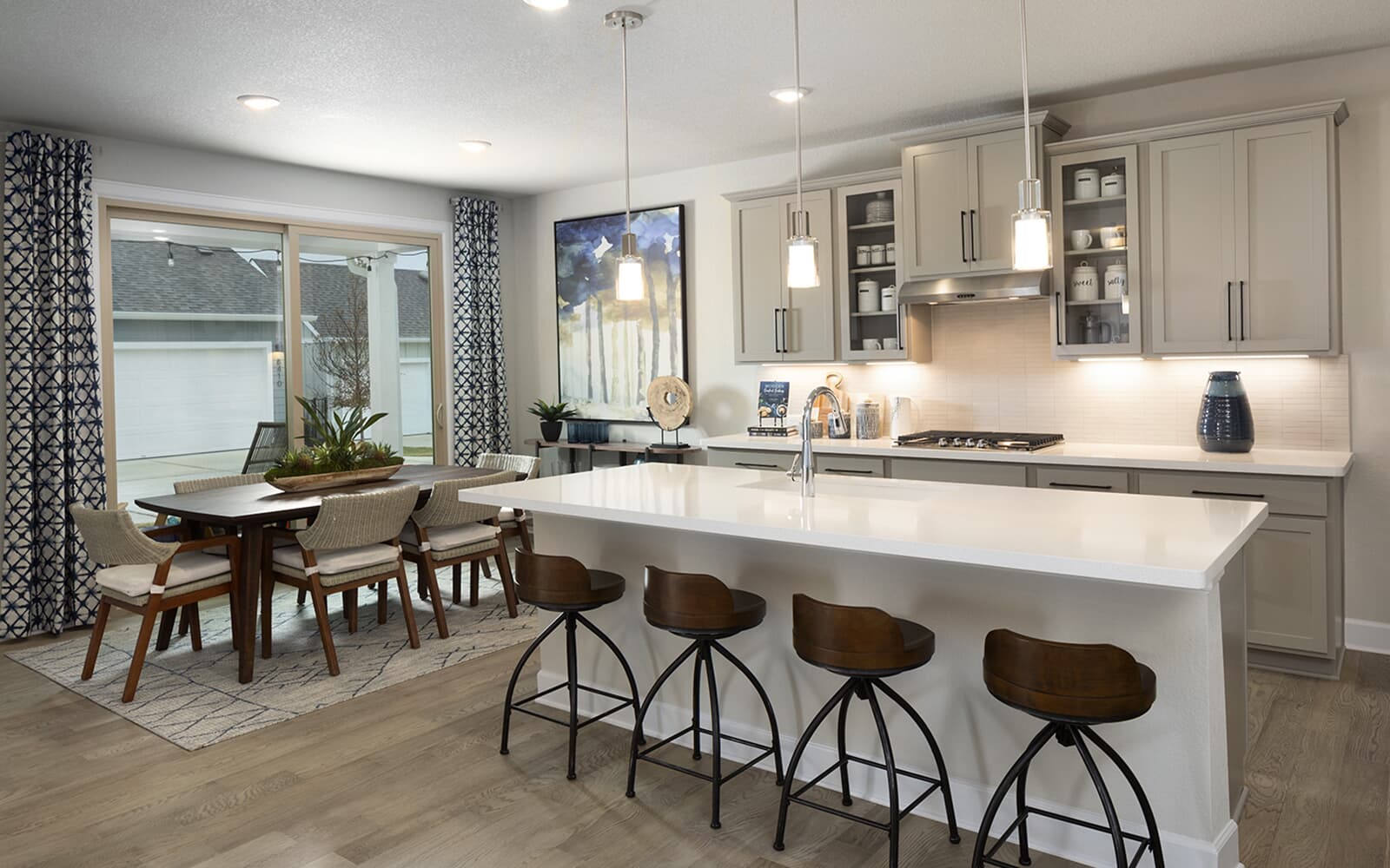 8810 Marmoset Way Austin, TX 78744 - Photo 8 of 19 a kitchen with a table chairs sink and cabinets
