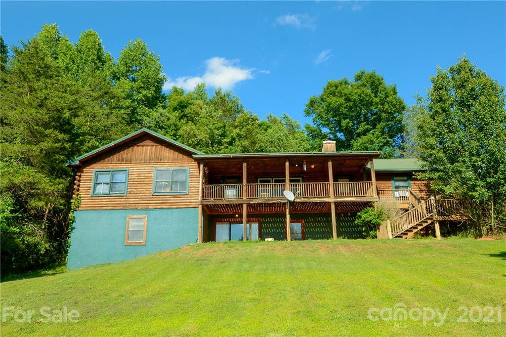687 John Shehan Road Tryon, NC 28782 - Photo 1 of 20 a front view of a house with a yard