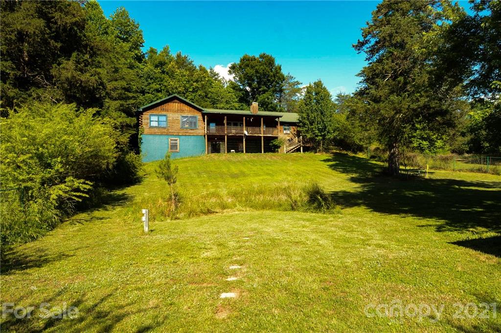 687 John Shehan Road Tryon, NC 28782 - Photo 2 of 20 a view of an house with swimming pool