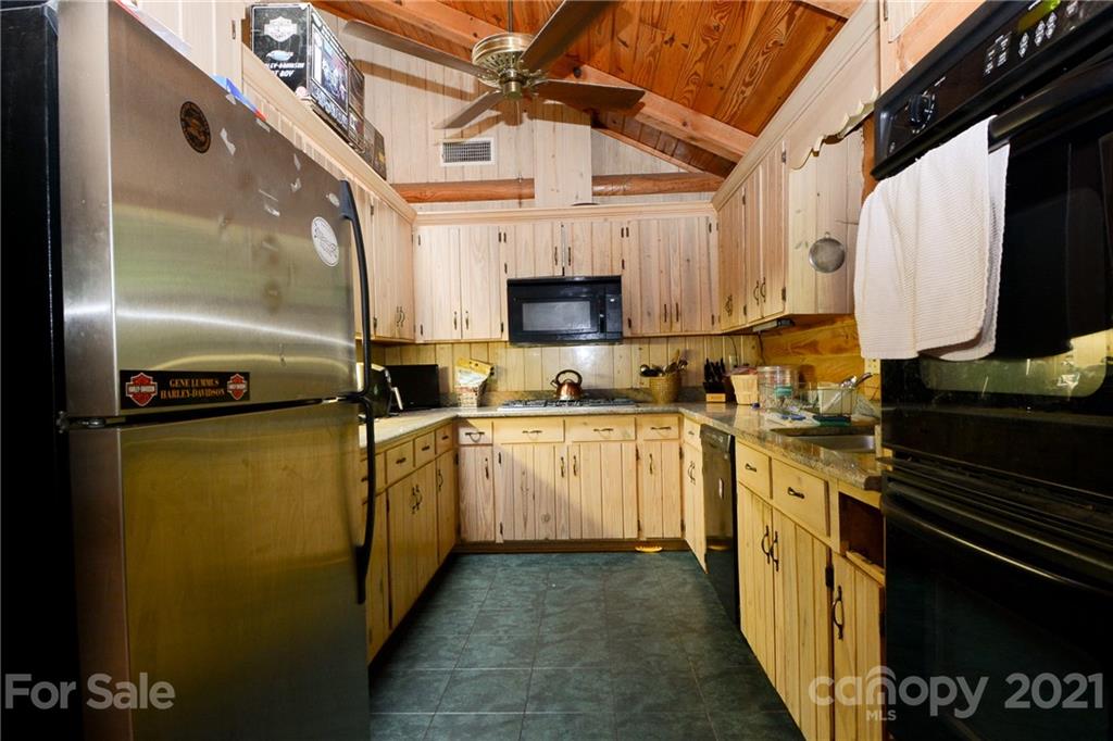 687 John Shehan Road Tryon, NC 28782 - Photo 11 of 20 a kitchen with a sink appliances and cabinets