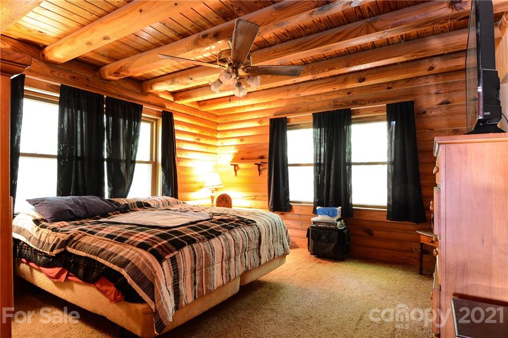 687 John Shehan Road Tryon, NC 28782 - Photo 12 of 20 a bedroom with a bed next to a window