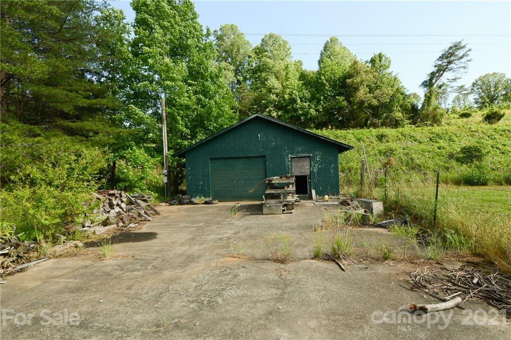 687 John Shehan Road Tryon, NC 28782 - Photo 17 of 20 a view of a house with backyard and sitting area