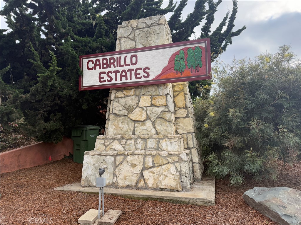 200 Madera Street Los Osos, CA 93402 - Photo 13 of 13 a street sign that is sitting on a brick wall