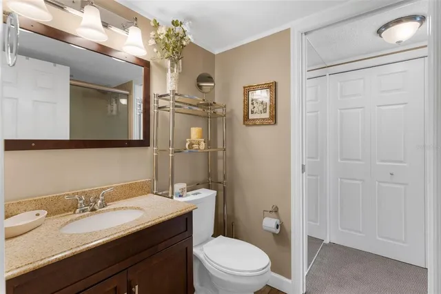 a bedroom with a bed and glass door