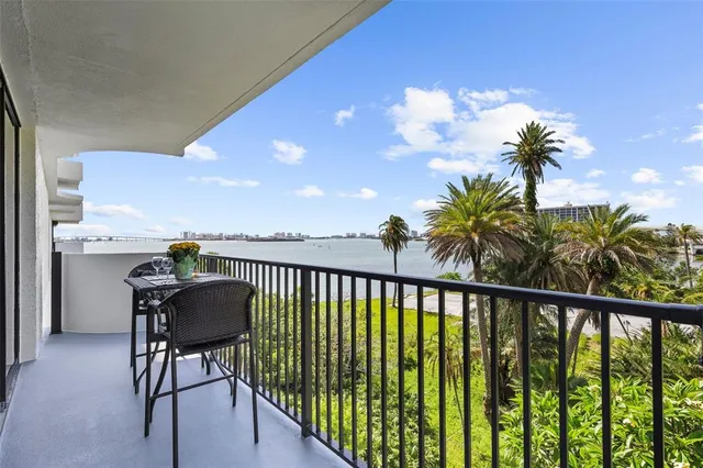 a view of a swimming pool with a patio and a garden