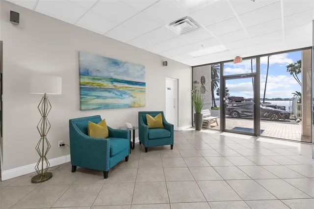 a kitchen with stainless steel appliances granite countertop a sink and dishwasher a refrigerator with wooden cabinets