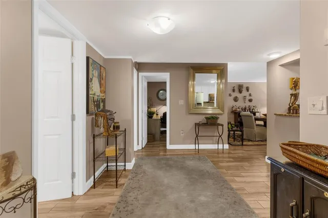 a view of a kitchen with refrigerator and front door