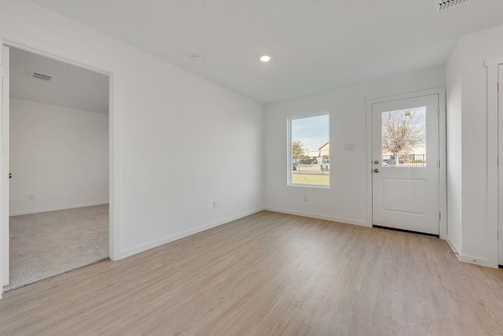 1225 Finch Drive Cleburne, TX 76031 - Photo 7 of 16 Foyer with light wood finished floors and recessed lighting
