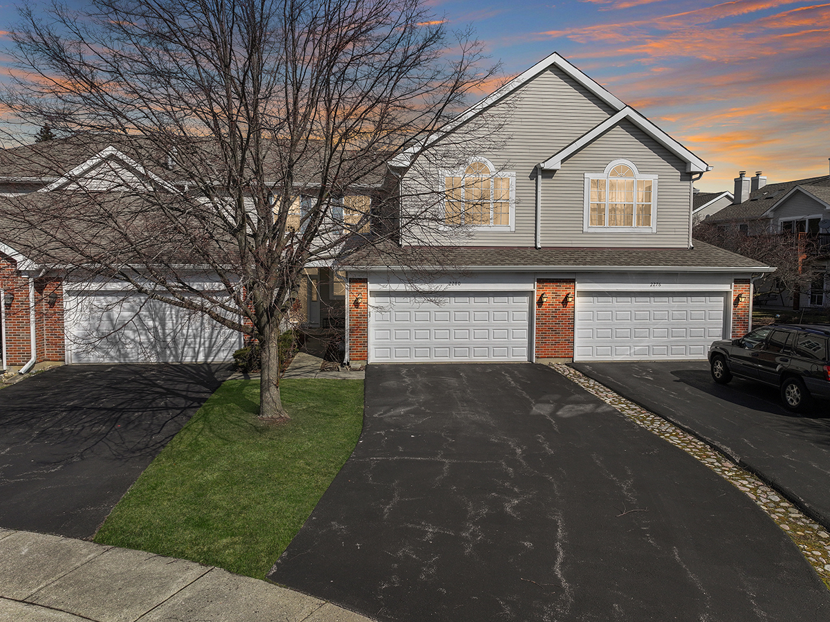 2280 Briar Court Hoffman Estates, IL 60169 - Photo 1 of 36 a front view of a house with a yard and garage