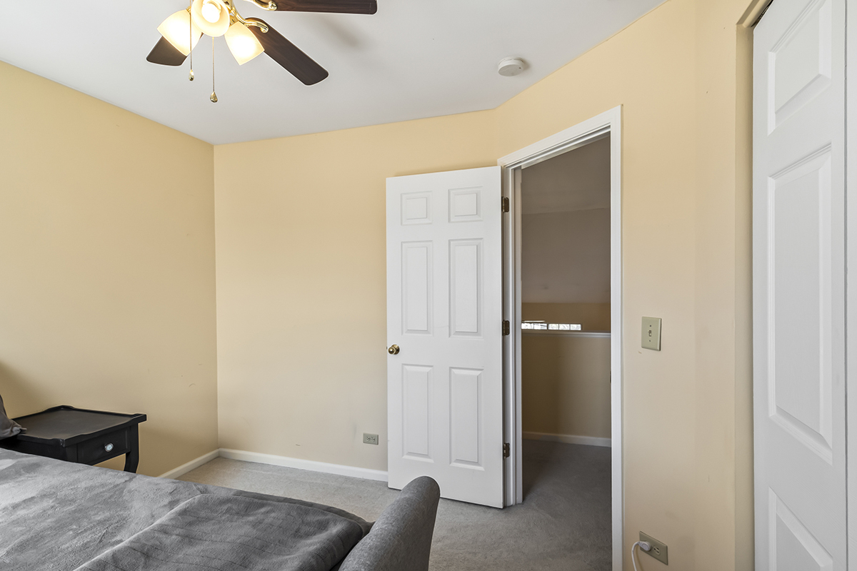 2280 Briar Court Hoffman Estates, IL 60169 - Photo 25 of 36 a view of livingroom with hardwood floor and ceiling fan