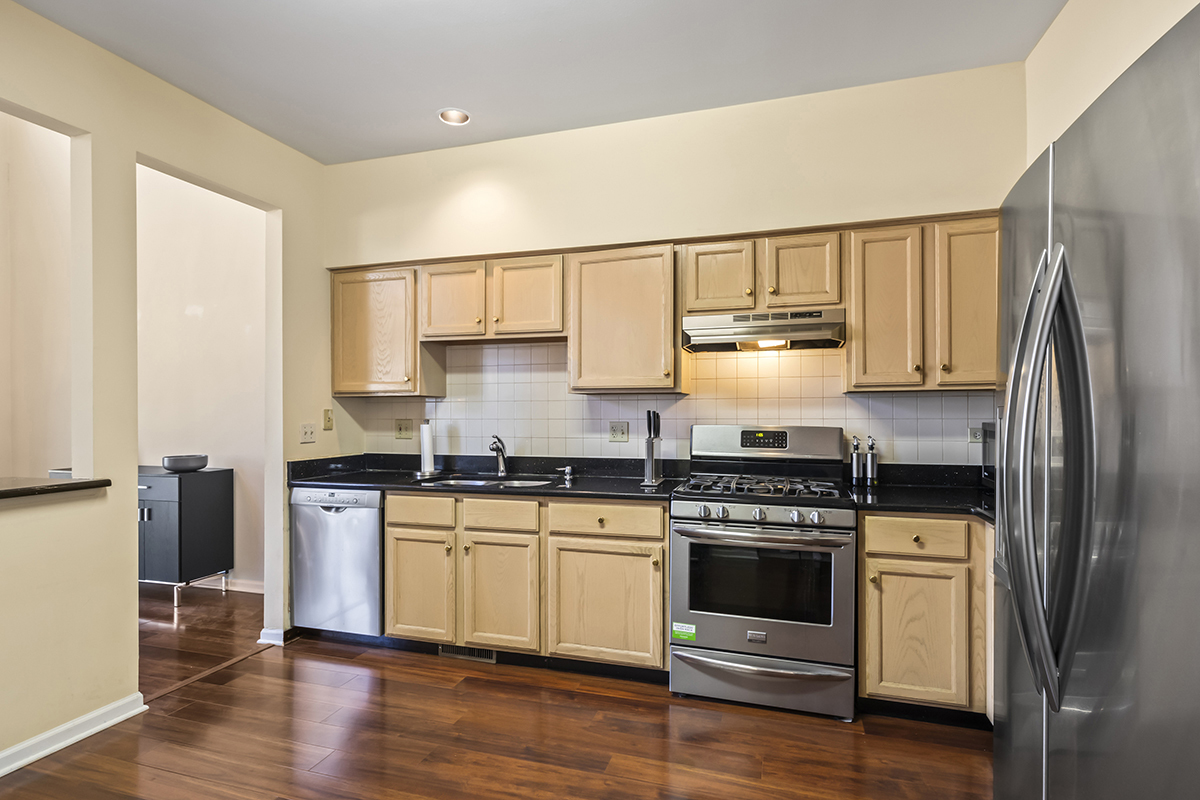 2280 Briar Court Hoffman Estates, IL 60169 - Photo 5 of 36 a kitchen with a stove a sink and a refrigerator