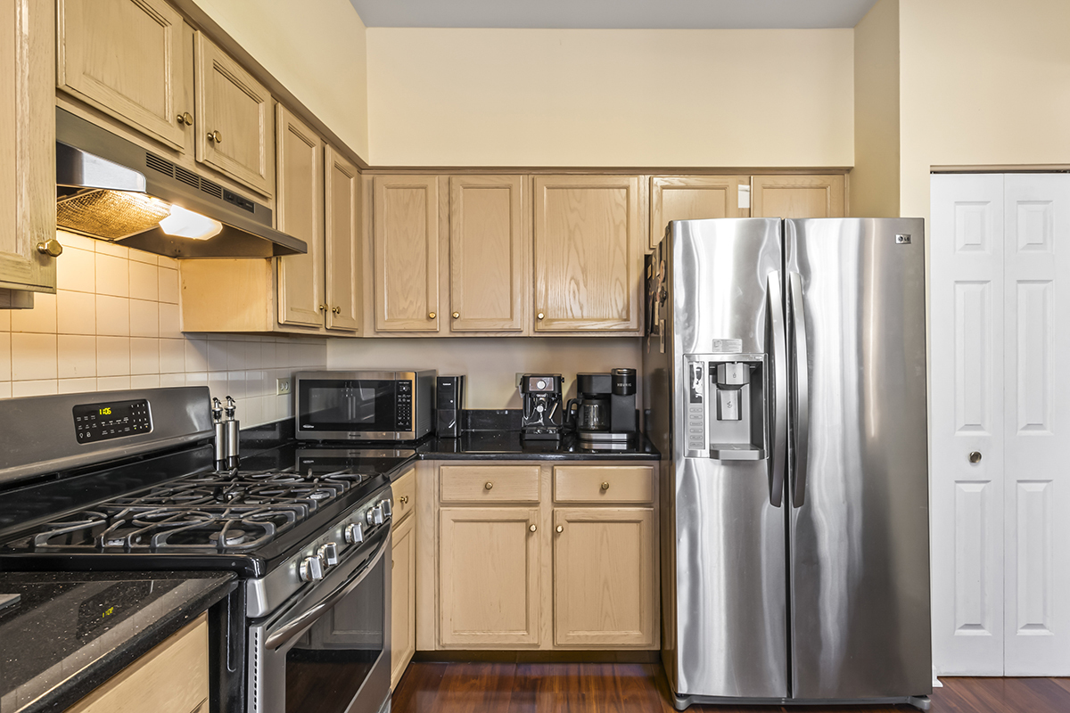 2280 Briar Court Hoffman Estates, IL 60169 - Photo 7 of 36 a kitchen with stainless steel appliances granite countertop a refrigerator and a stove