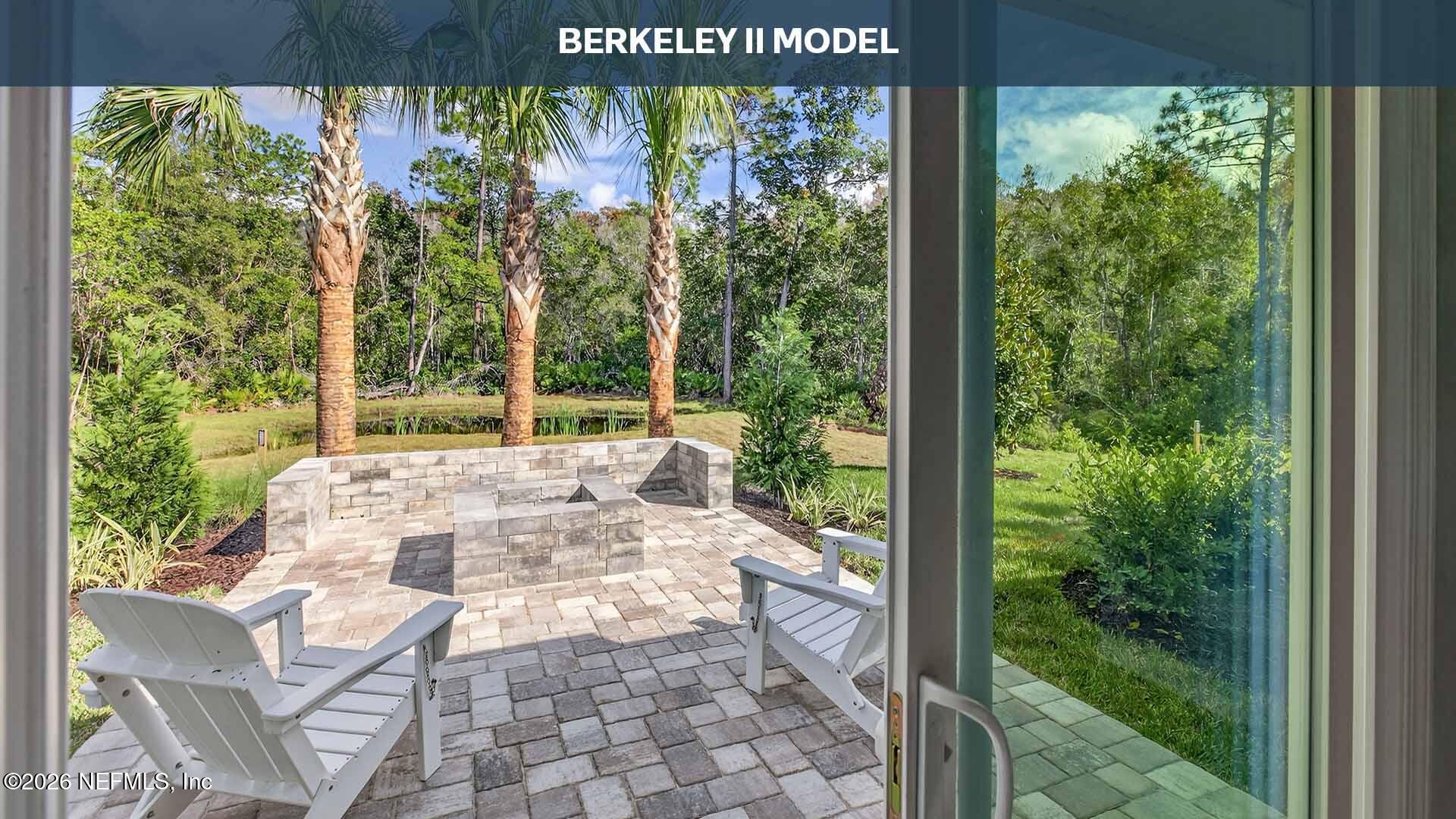 12413 Russian Olive Road Jacksonville, FL 32218 - Photo 23 of 52 a view of a patio with table and chairs and floor to ceiling window with garden view