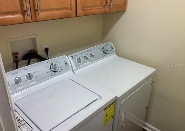 a utility room with dryer and washer