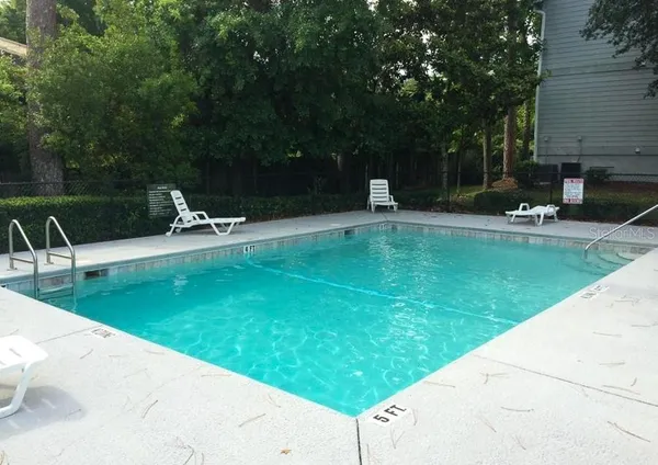 a view of a swimming pool with a patio