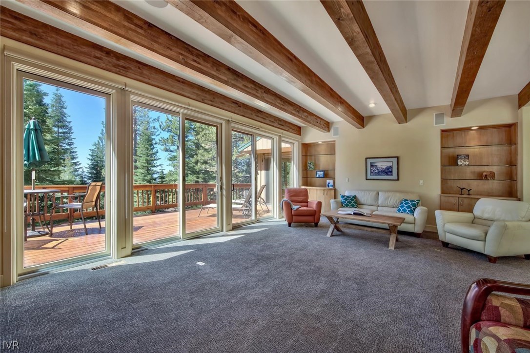997 Apollo Way Incline Village, NV 89451 - Photo 8 of 35 a living room with furniture and a floor to ceiling window
