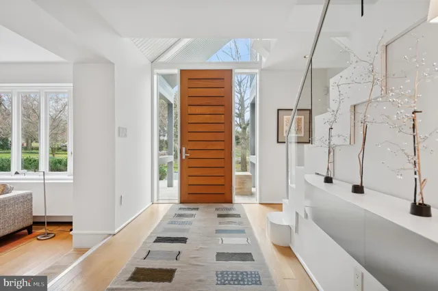 a kitchen with stainless steel appliances granite countertop wooden cabinets a oven and granite counter tops with a stove