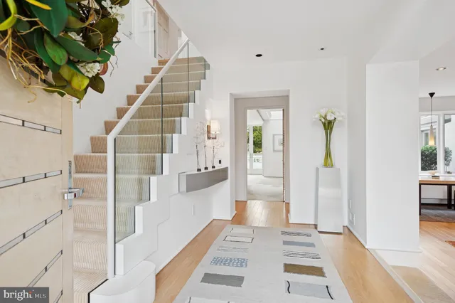 a kitchen with stainless steel appliances granite countertop a sink and a refrigerator