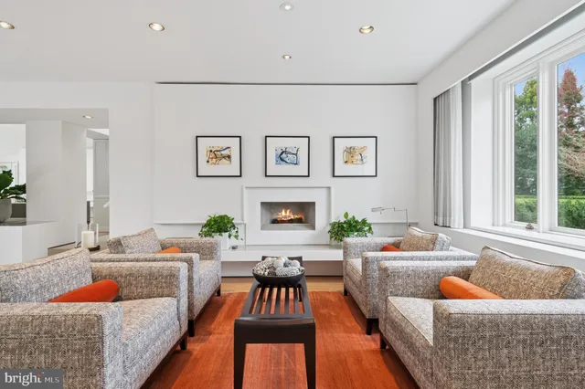 a kitchen with stainless steel appliances kitchen island granite countertop a refrigerator and microwave