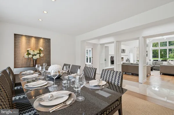 a bathroom with a sink a toilet a mirror and shower curtain