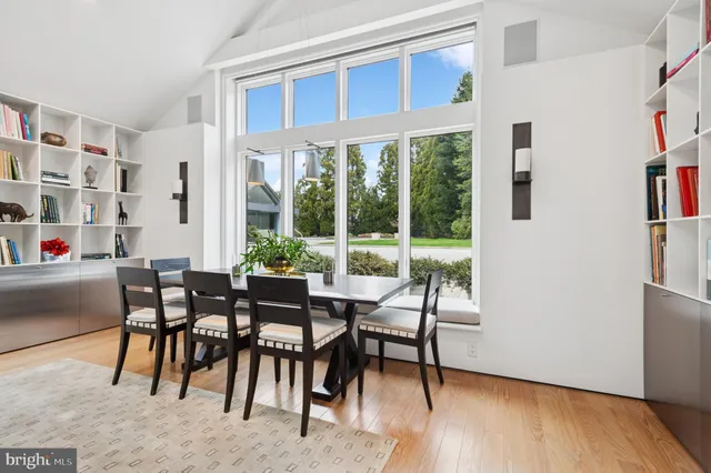 a view of swimming pool with chairs and tables