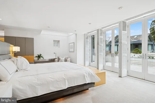 a view of a patio with a table chairs and a table