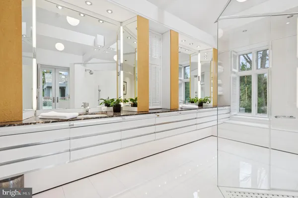 a living room with couch and a large window