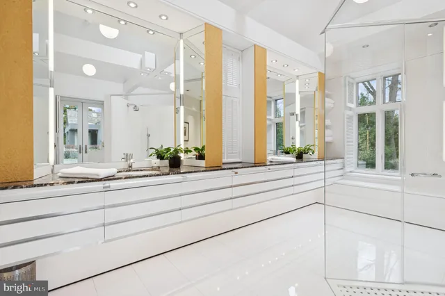 a living room with couch and a large window