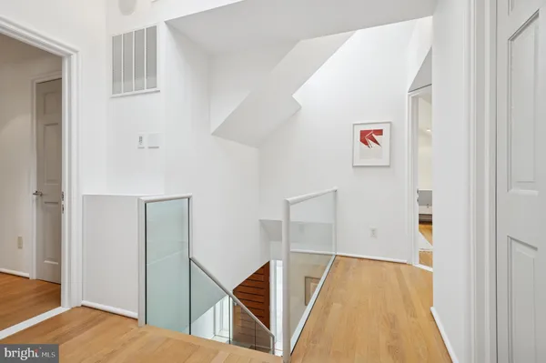 a bedroom with furniture and a large window