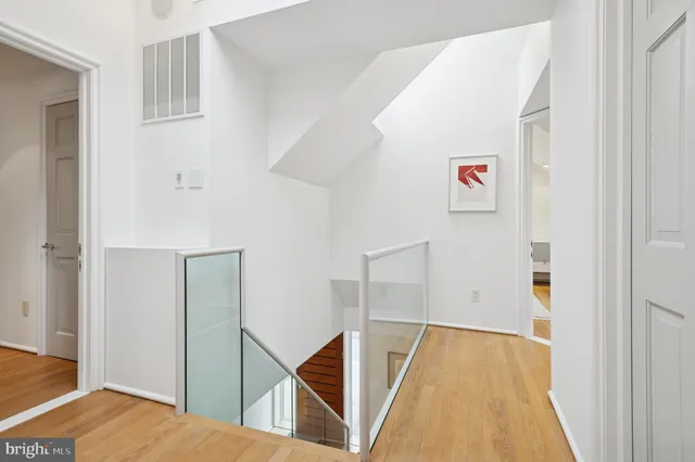 a bedroom with furniture and a large window