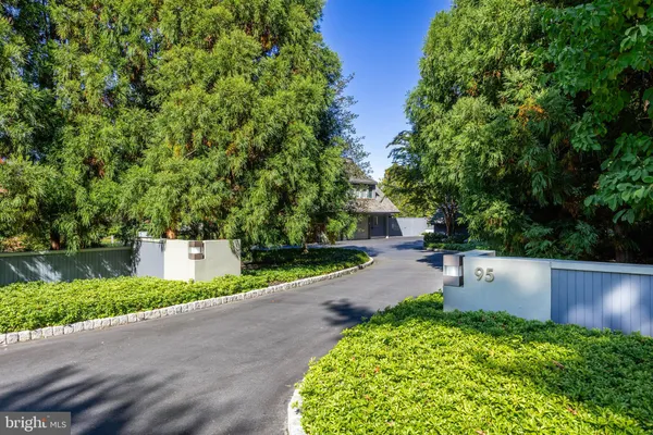 a view of a tree in front of a house