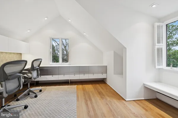 a view of a dining table with chairs in front of a house