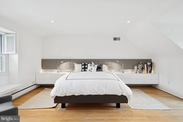 an aerial view of a house with a yard and garden