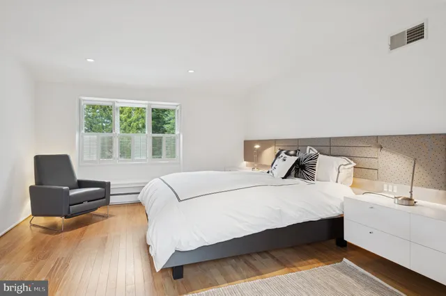 an aerial view of multiple houses with yard