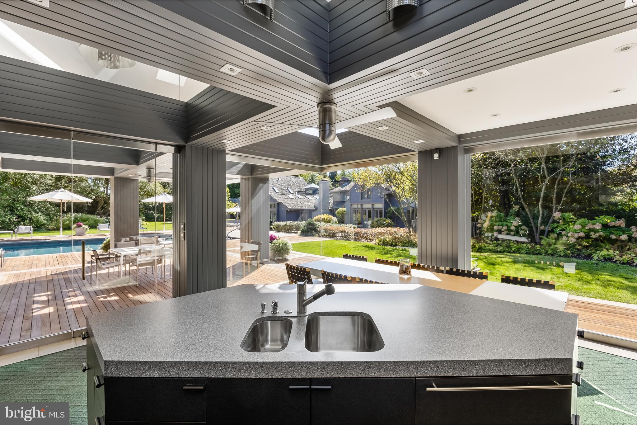95 Lane Of Acres Haddonfield, NJ 08033 - Photo 88 of 114 a view of a dining table with chairs in front of a house