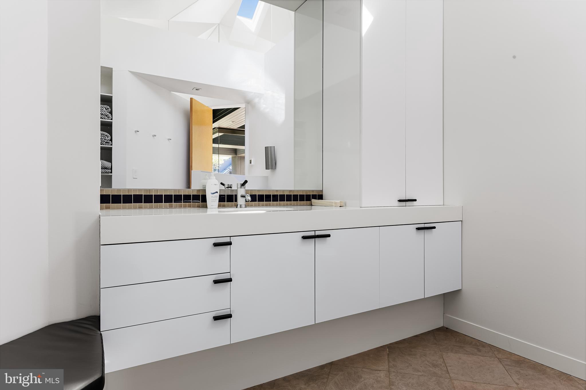 95 Lane Of Acres Haddonfield, NJ 08033 - Photo 95 of 114 a bathroom with a sink and a mirror
