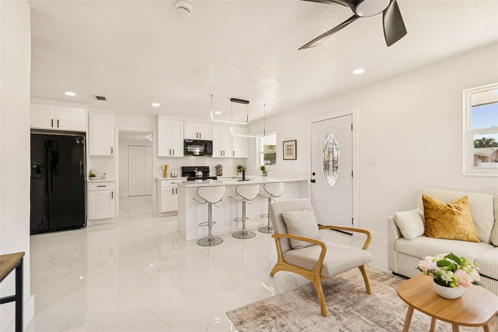 7097 Delta Way Clearwater, FL 33764 - Photo 20 of 71 a living room with furniture and kitchen view