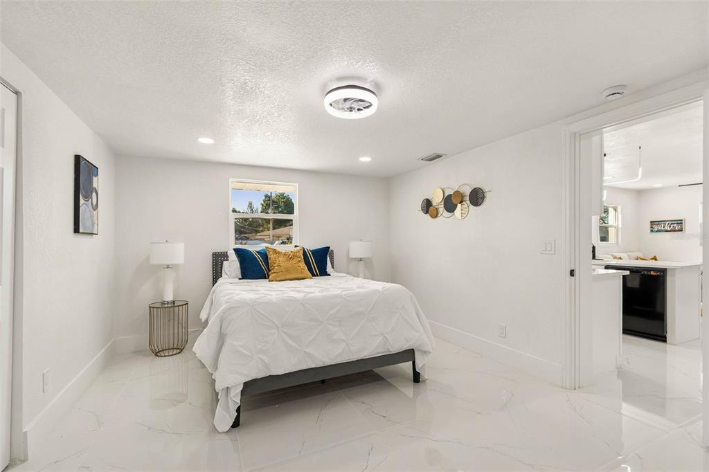 7097 Delta Way Clearwater, FL 33764 - Photo 35 of 71 a bedroom with a bed and a table