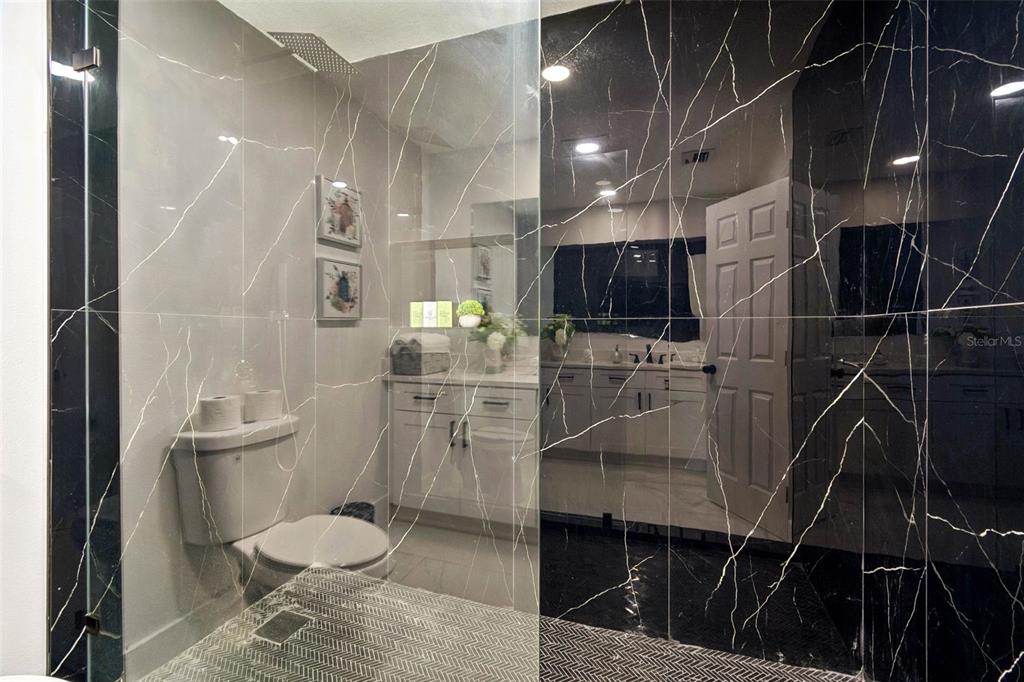 7097 Delta Way Clearwater, FL 33764 - Photo 43 of 71 a bathroom with a toilet and a shower