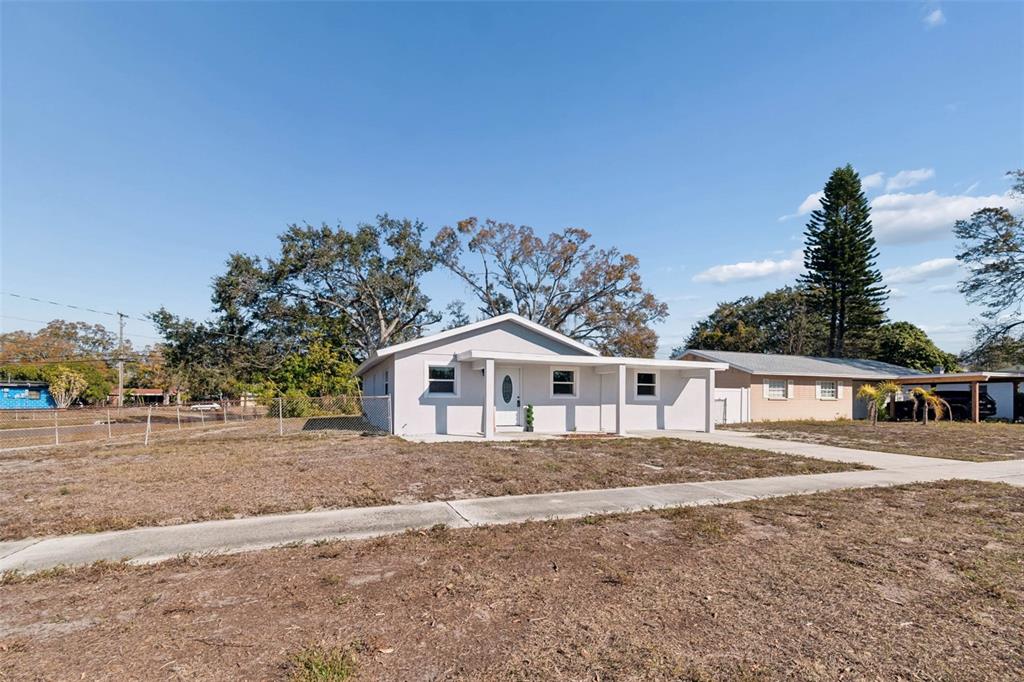 7097 Delta Way Clearwater, FL 33764 - Photo 5 of 71 a view of a house with a yard and balcony