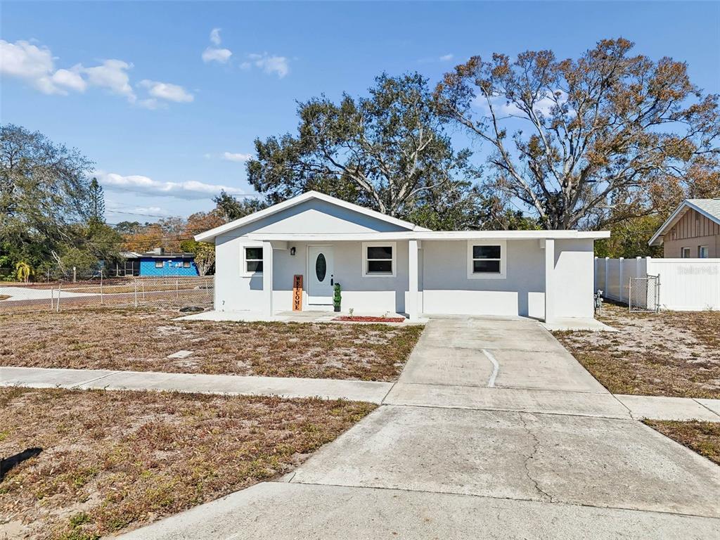 7097 Delta Way Clearwater, FL 33764 - Photo 57 of 71 front view of a house with a yard